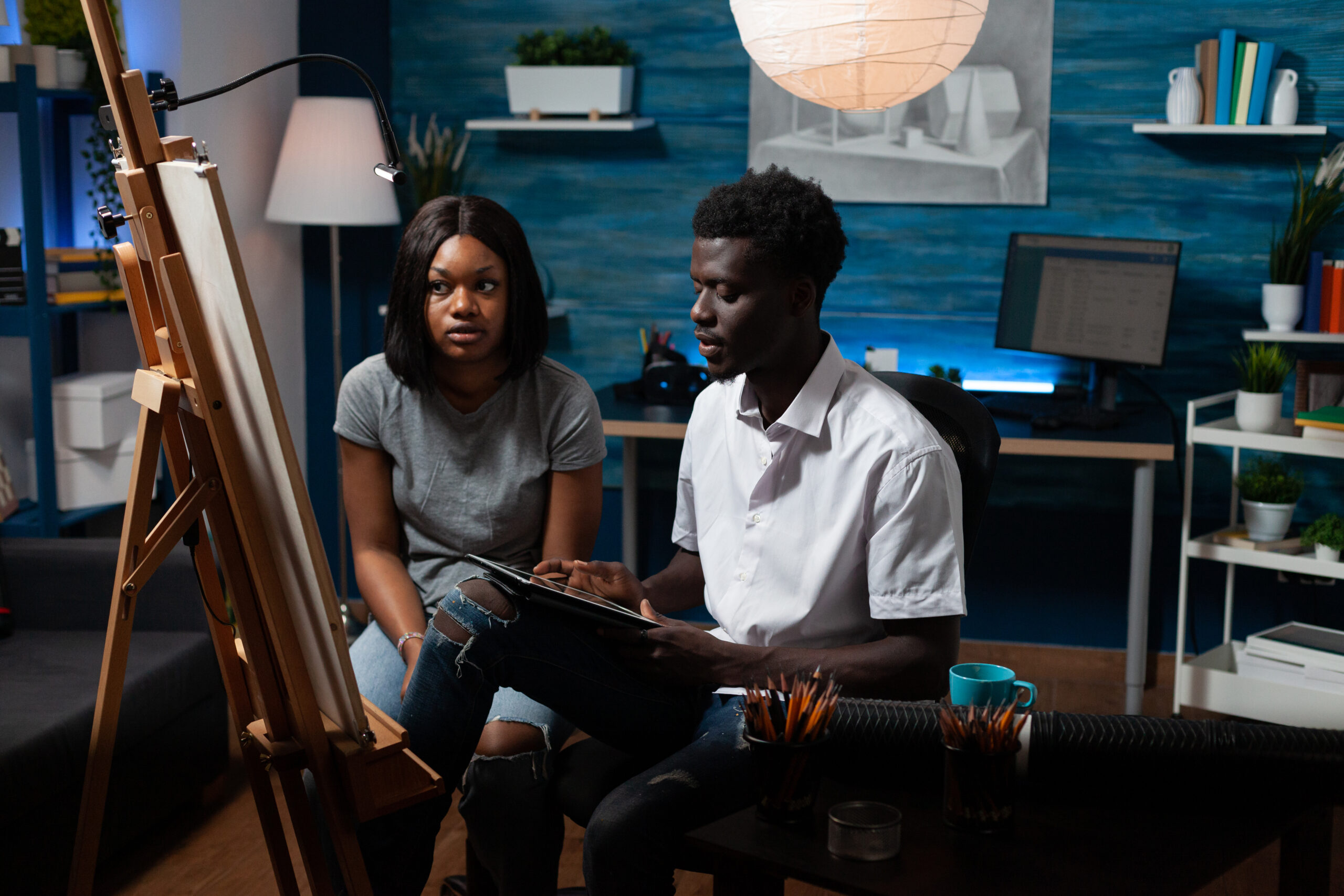 young artists searching for draw inspiration on tablet
